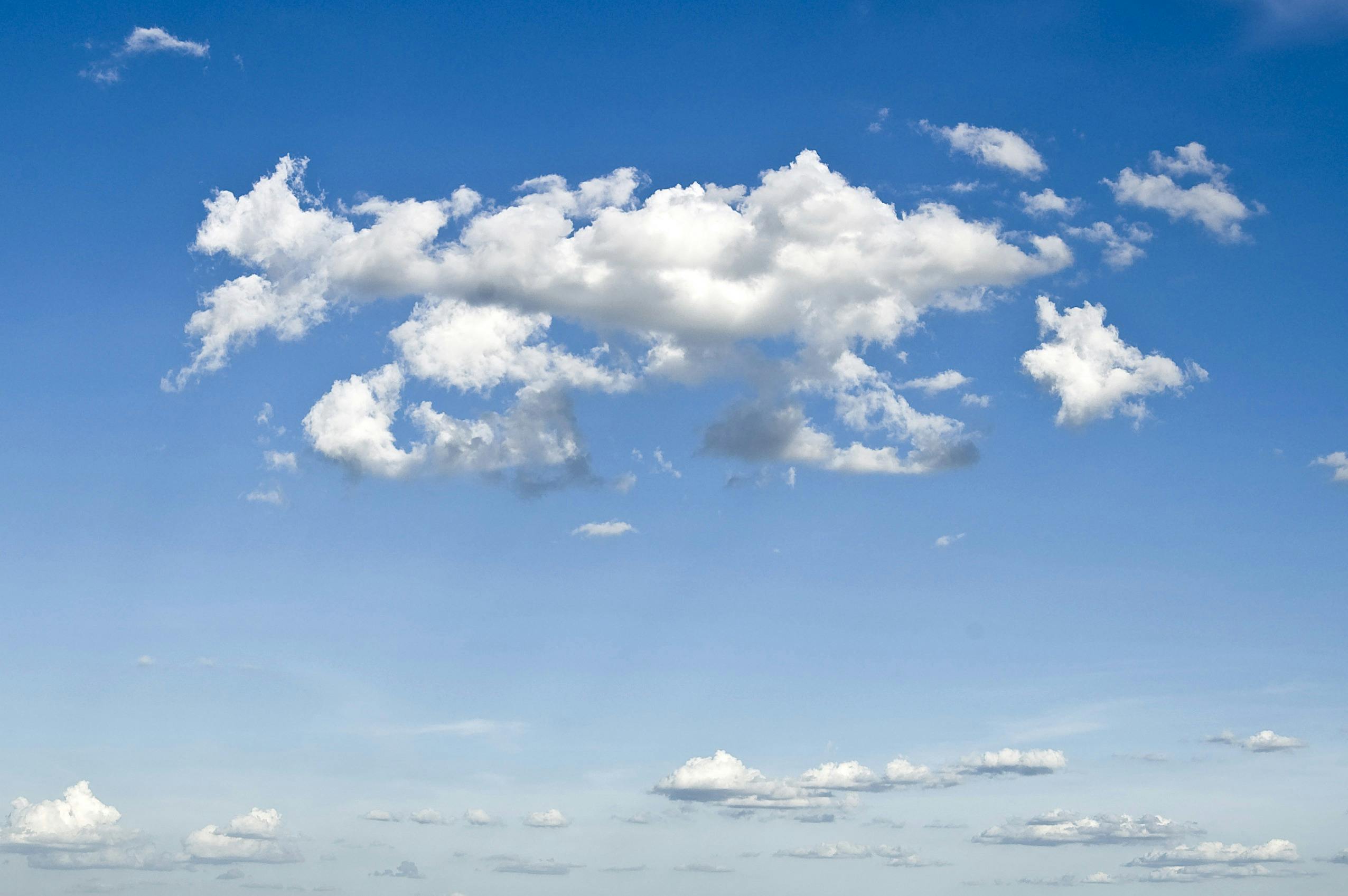 conveyancing White clouds covering the blue sky.