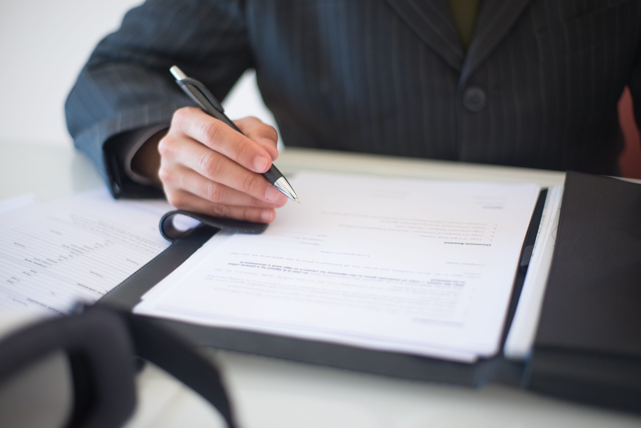 Legal professional reviewing paperwork as part of a deceased estate administration matter