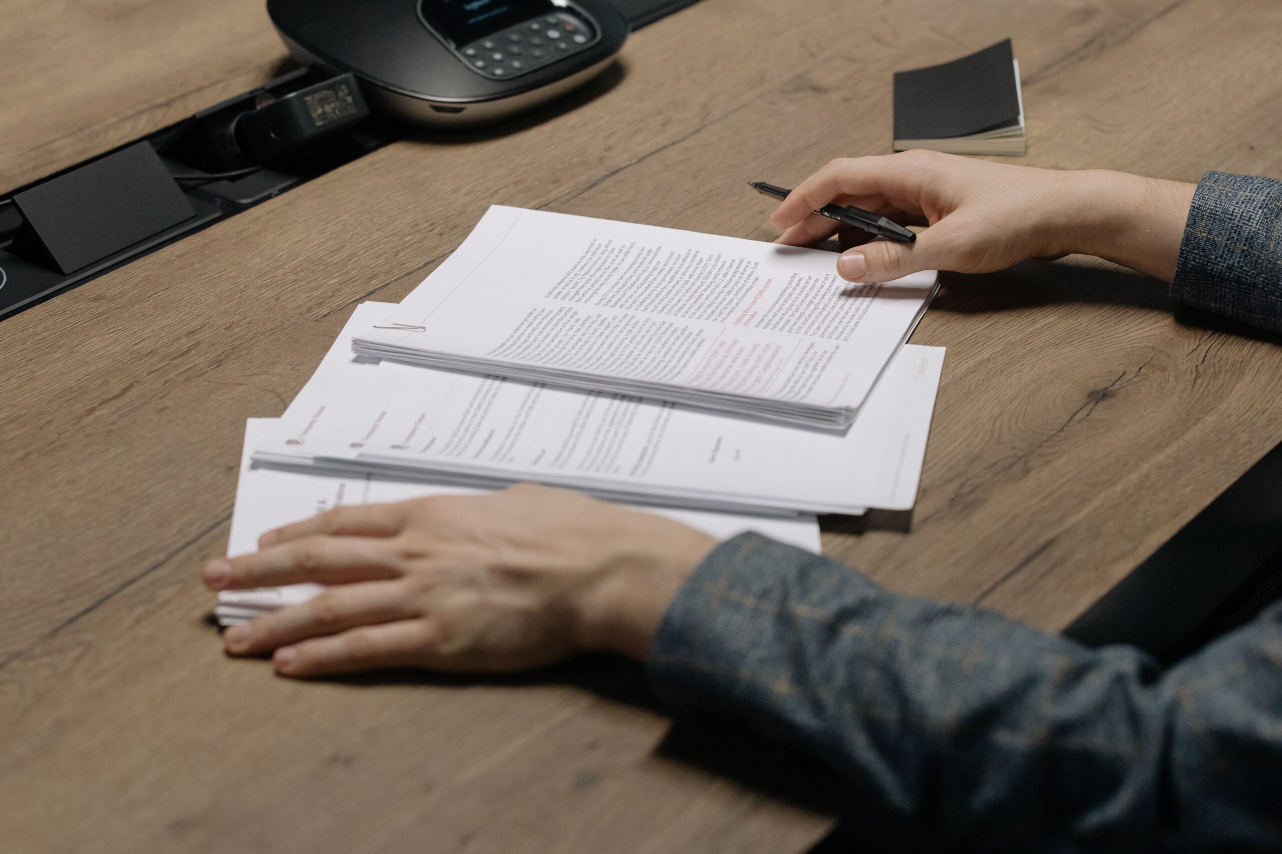 Surviving spouse reviewing documents at a table