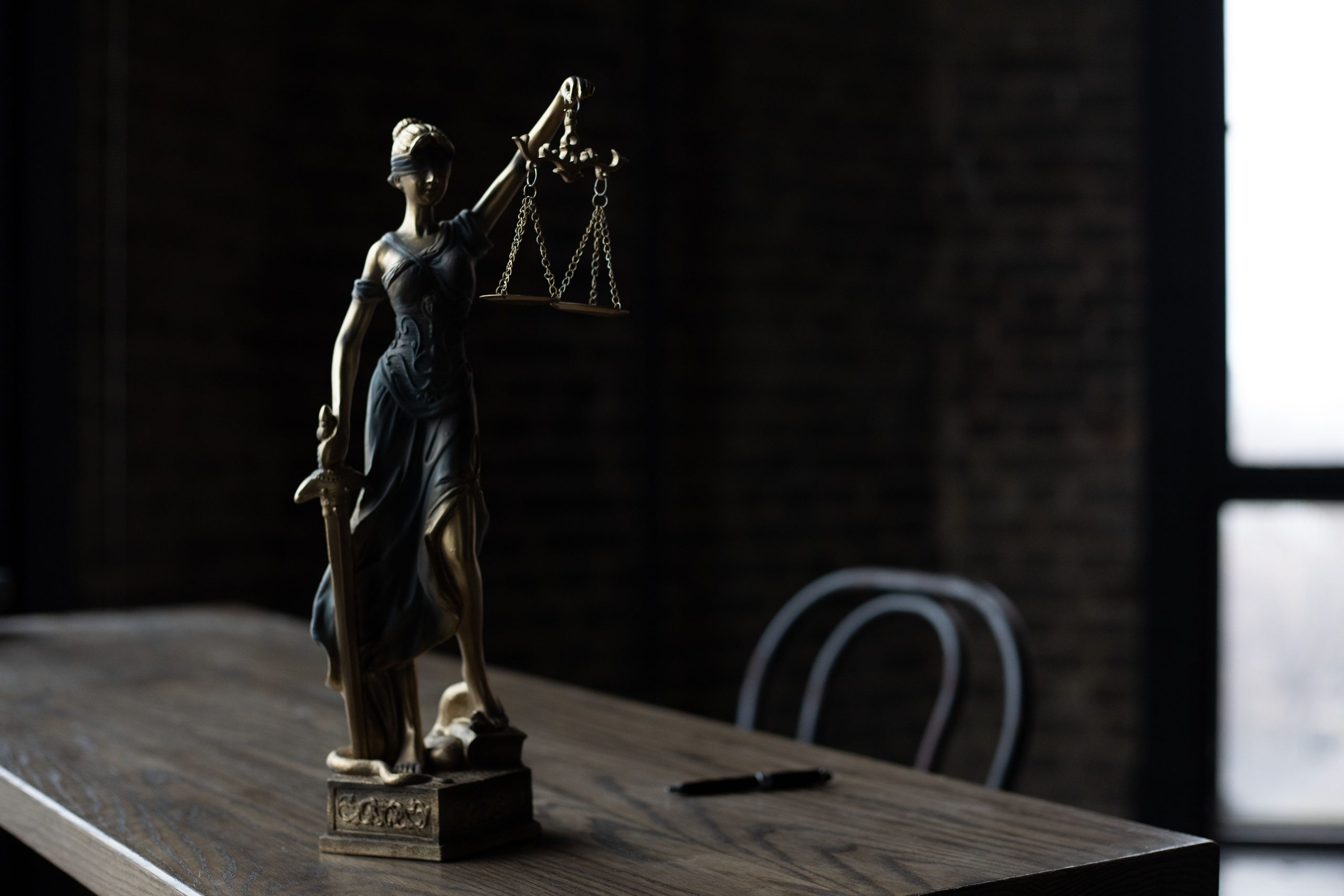 Executor Law - How to Plan Your Estate When You Own Property Abroad Scales of justice on a desk, symbolising South African estate law and estate planning.