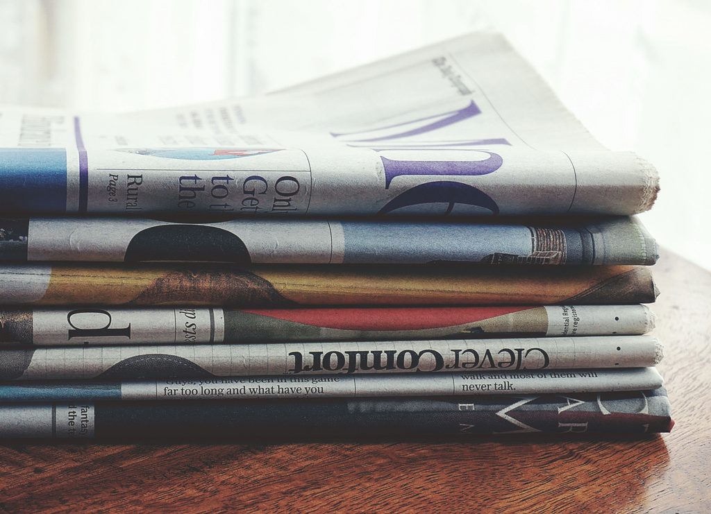 Stack of folded newspapers used to advertise for creditors of a deceased estate