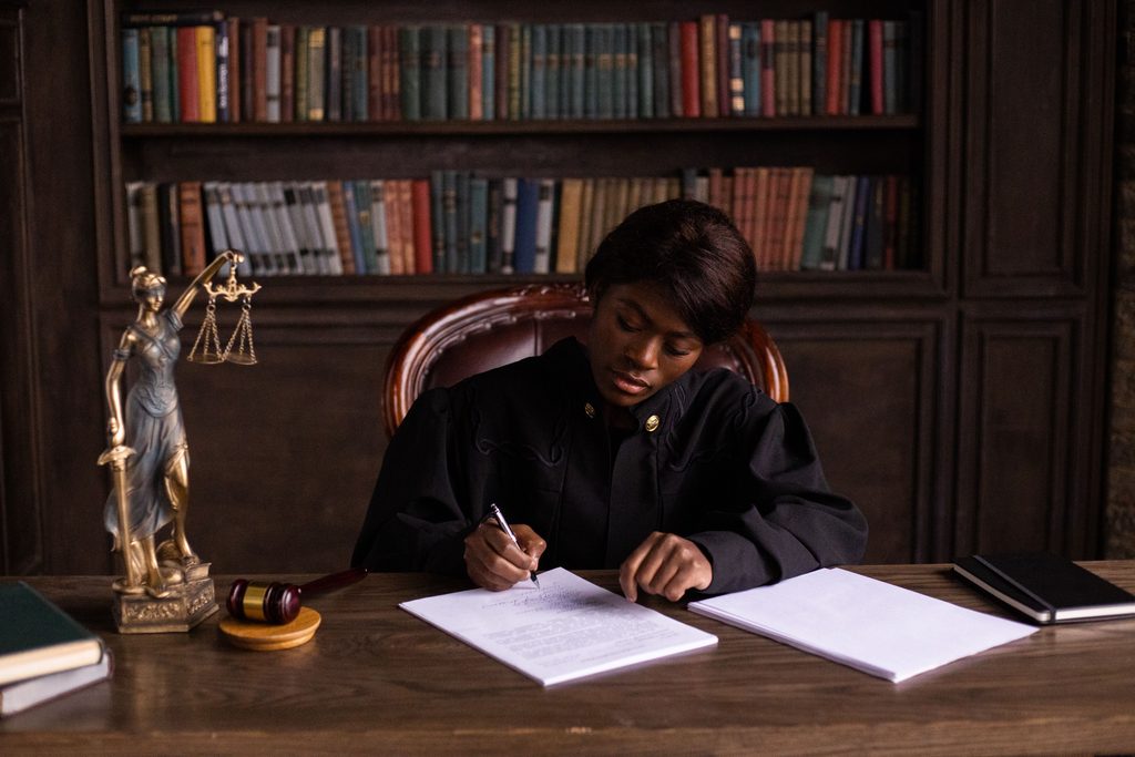 Curatorship South Africa: attorney signing court application documents.