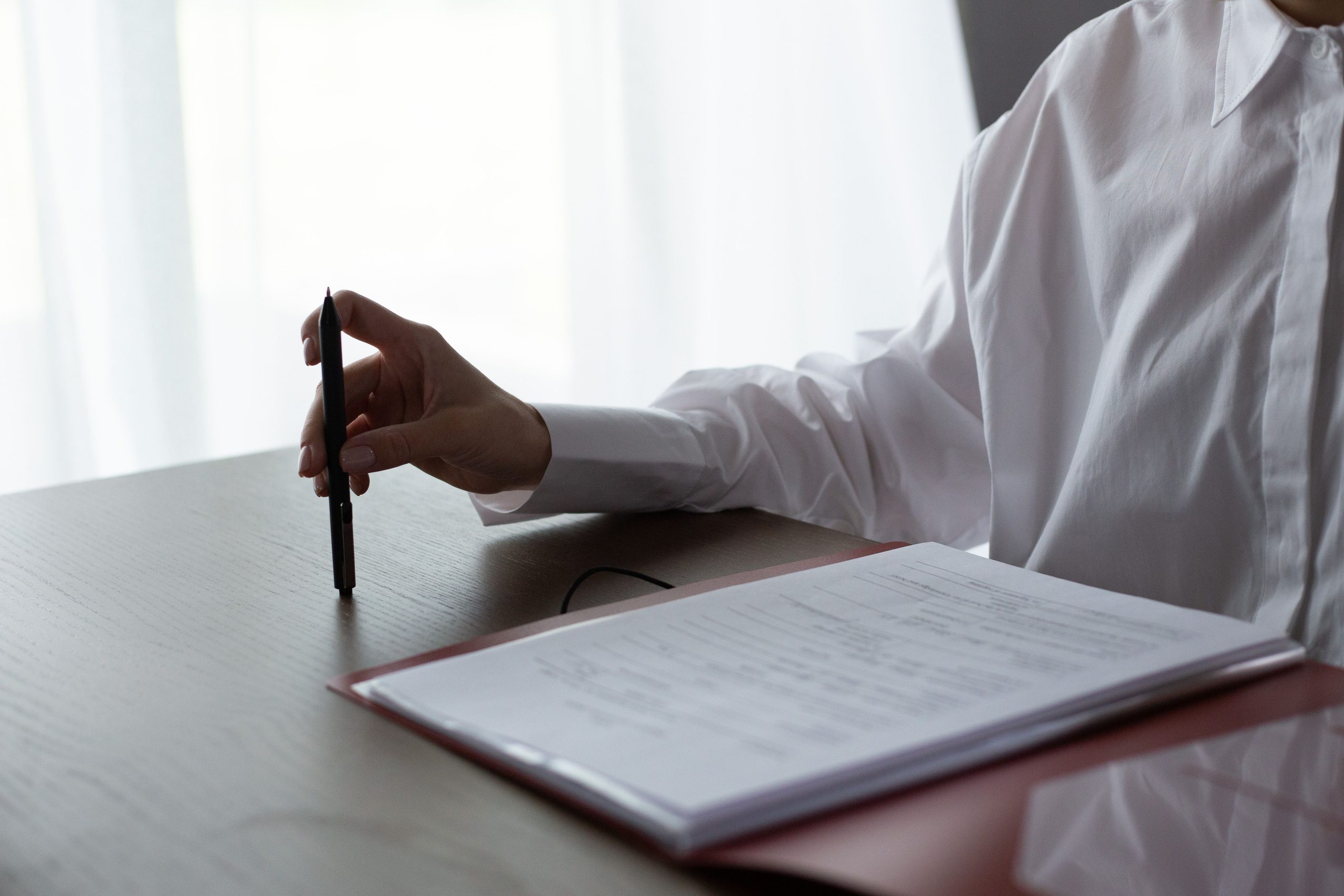 Notary public signing a legal document in South Africa.