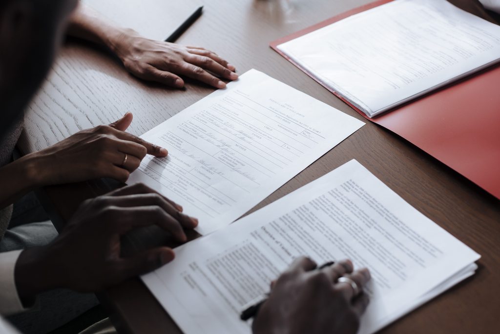 Family reviewing High Court application document.